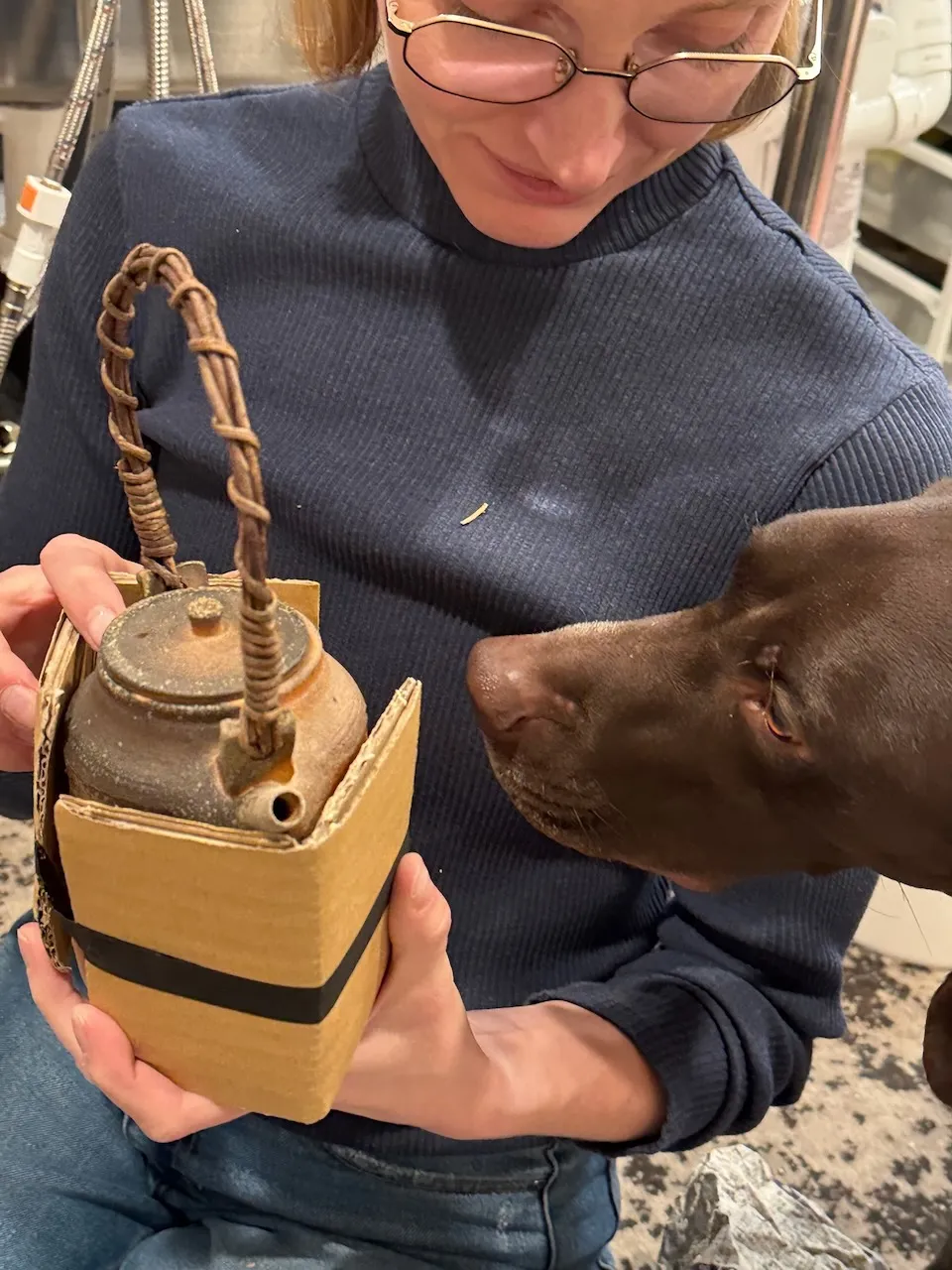 Gracie unboxing Ido Ferber’s pot, Birdie wondering what Japan smells like